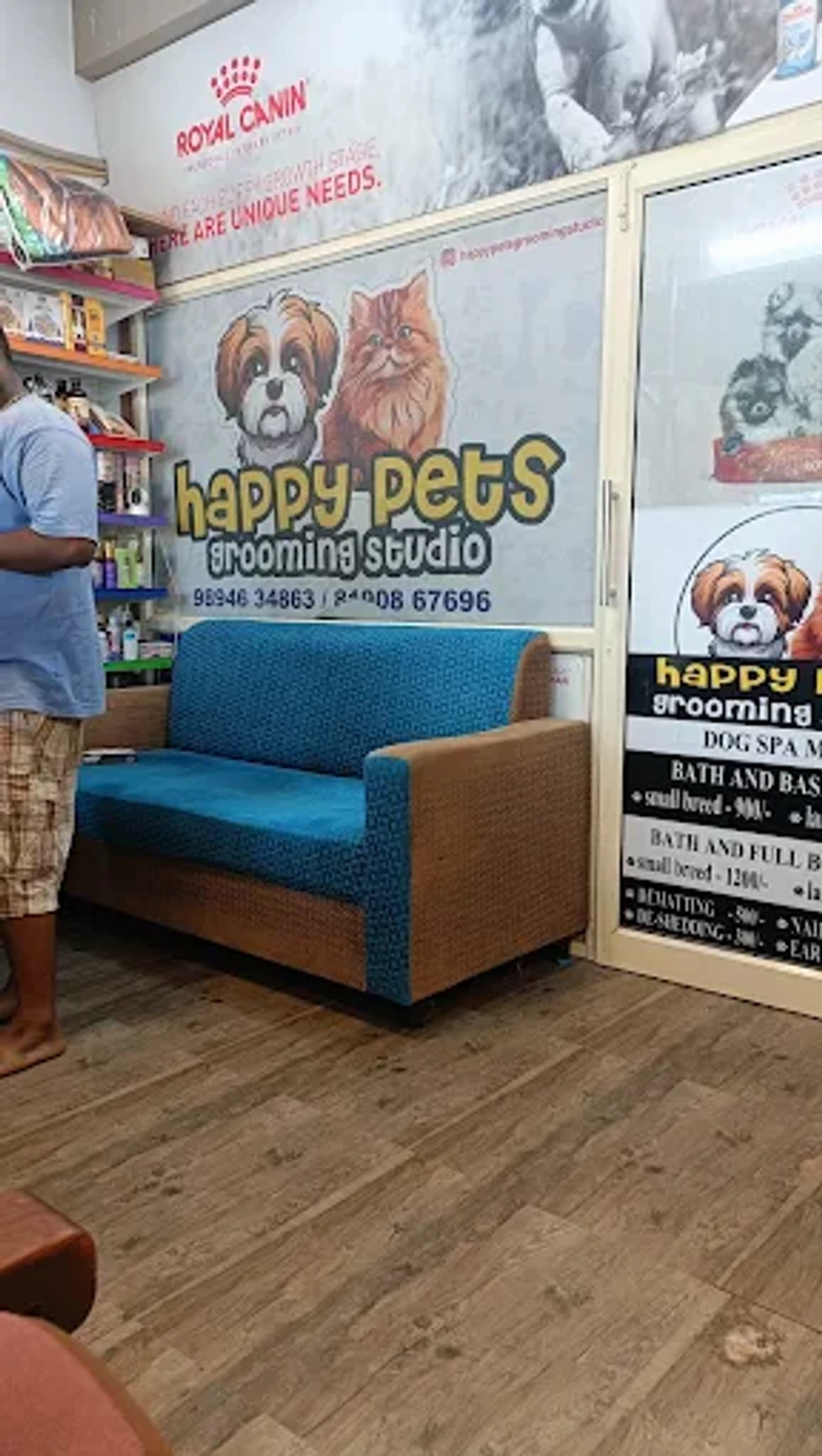 Blue seating inside the pet shop beside Happy Pets Grooming Studio signage